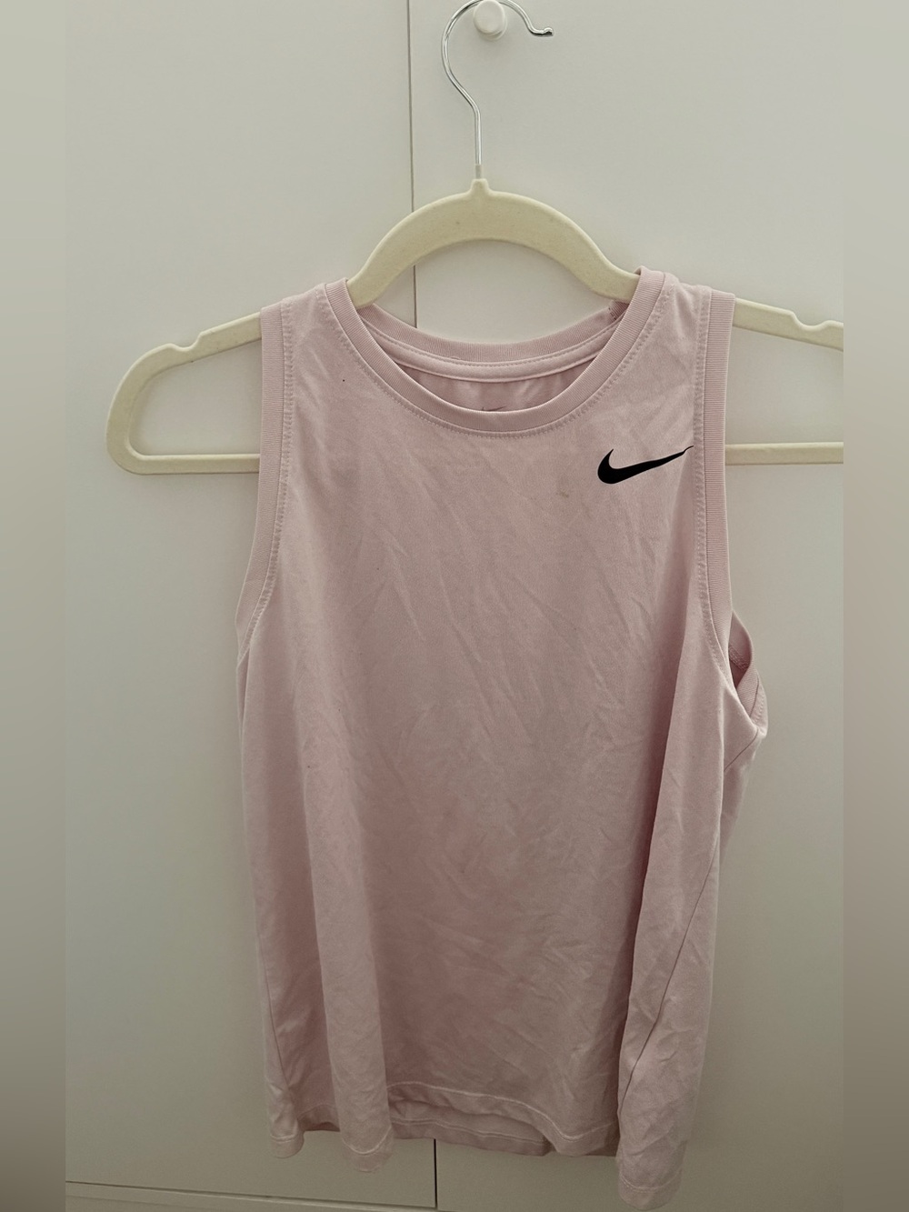Nike Women’s Light Pink Muscle Tank with Black Swoosh